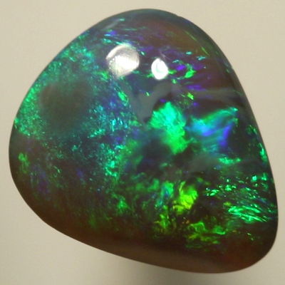SOLID SEMI BLACK OPAL Sparkles of green and turquoise over a high dome